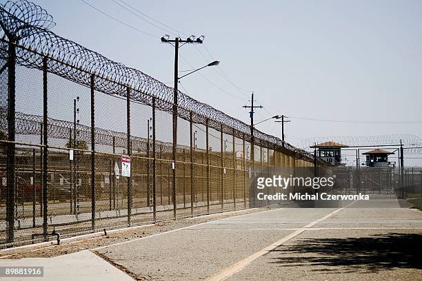 The California Institution for Men prison fence is seen on August 19, 2009 in Chino, California. After touring the prison where a riot took place on...