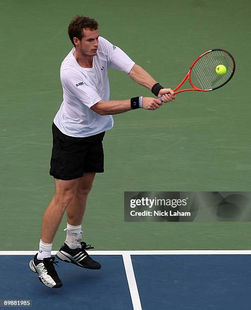 Andy Murray of Great Britain hits a backhand against Nicolas Almagro of Spain during day three of the Western & Southern Financial Group Masters on...