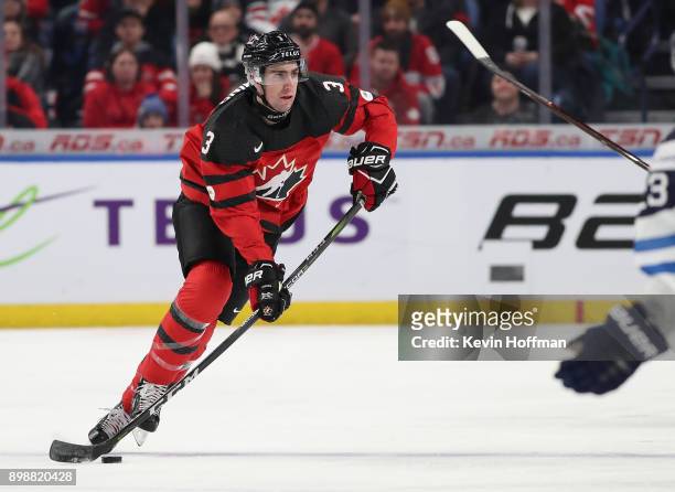 Conor Timmins of Canada skates up ice with the puck during the first period against Finland at KeyBank Center on December 26, 2017 in Buffalo, New...