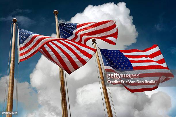 american_flags_against_clouds_and_sky - eric van den brulle ストックフォトと画像