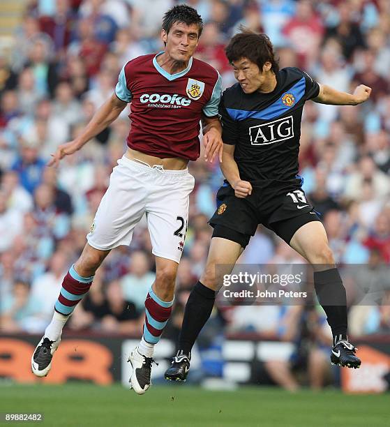Ji-Sung Park of Manchester United clashes with Stephen Jordan of Burnley during the FA Barclays Premier League match between Burnley and Manchester...