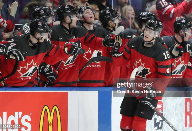 Taylor Raddysh of Canada celebrates with the bench after he scored on Finland during the second period at KeyBank Center on December 26, 2017 in...