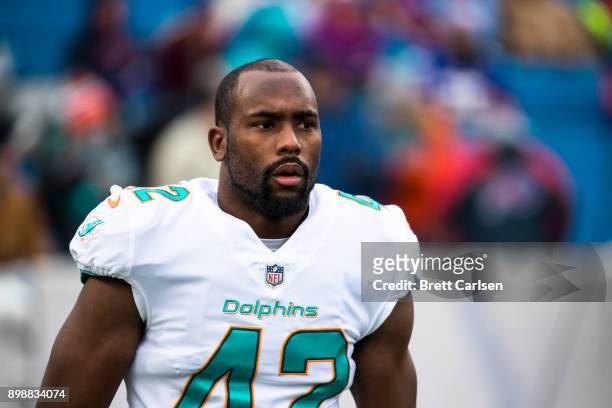 Alterraun Verner of the Miami Dolphins participates in warm ups before the game before the game against the Buffalo Bills at New Era Field on...