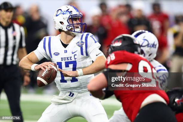 Daniel Jones of the Duke Blue Devils throws a first half pass while playing the Northern Illinois Huskies during the Quick Lane Bowl at Ford Field on...