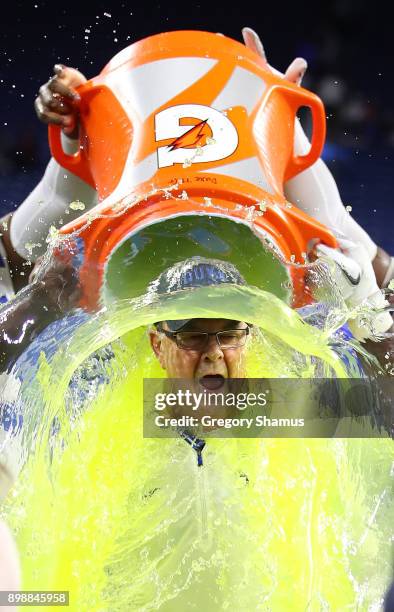 Head coach David Cutcliffe of the Duke Blue Devils reacts to his Gatorade bath by Mike Ramsay and Trevon McSwain after defeating the Northern...