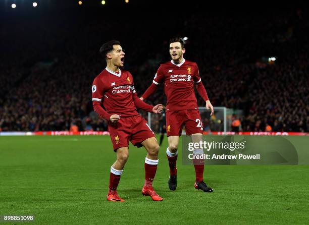 Philippe Coutinho of Liverpool celebrates after scoring the opening goal during the Premier League match between Liverpool and Swansea City at...