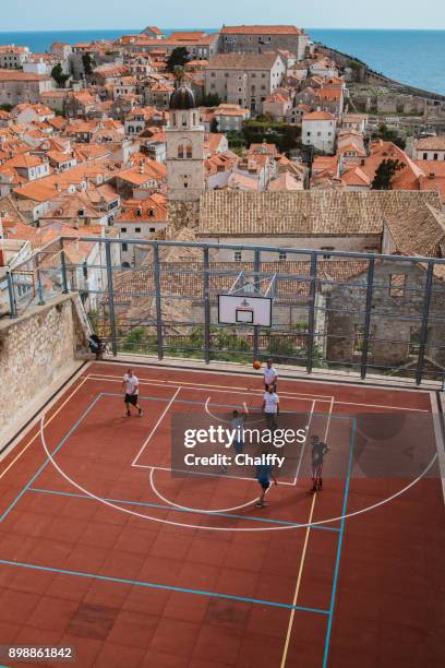 a basketball playground above dubrovnik old town - victory parish stock pictures, royalty-free photos & images