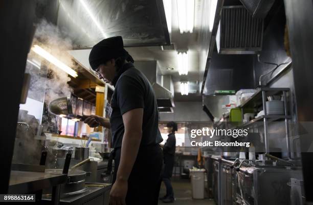 Hakata-Sanki Co. Employee boils ramen noodles at the company's restaurant in Dazaifu, Fukuoka, Japan, on Dec. 21, 2017. Fukuoka, on Japans southern...