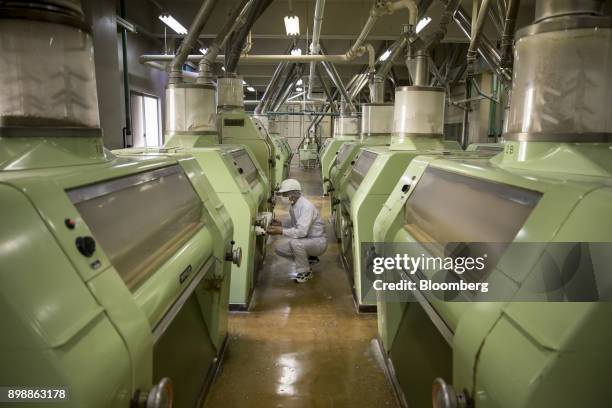 Tofuku Flour Mills Co. Employee operates a milling machinery at the company's facility in Dazaifu, Fukuoka, Japan, on Dec. 21, 2017. Fukuoka, on...