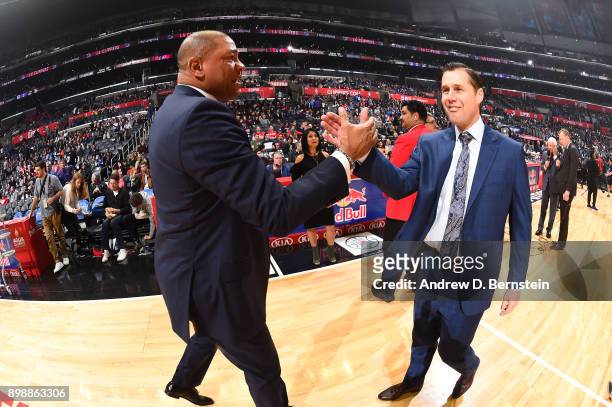 Head Coaches Doc Rivers of the LA Clippers and David Joerger of the Sacramento Kings talk before the game on December 26, 2017 at STAPLES Center in...