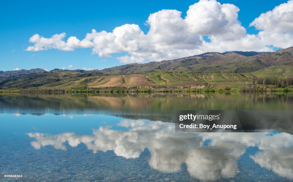 The perfect reflection of lake Dunstan in Otago region of New Zealand.