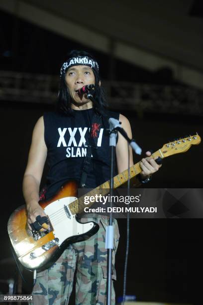 This photo taken on December 26, 2017 shows Indonesian rock band Slank performing during the Big Bang Slank Music Concert in Jakarta. / AFP PHOTO /...