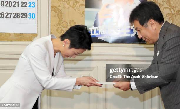 Former Democratic Party leader Renho greets the Constitutional Democratic Party of Japan leader Yukio Edano at the diet building on December 26, 2017...