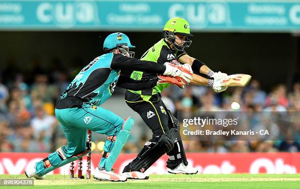 Callum Ferguson of the Thunder plays a shot during the Big Bash League match between the Brisbane Heat and the Sydney Thunder at The Gabba on...