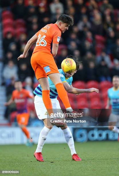 Regan Poole of Northampton Town rises above John Marquis of Doncaster Rovers to head the ball during the Sky Bet League One match between Doncaster...