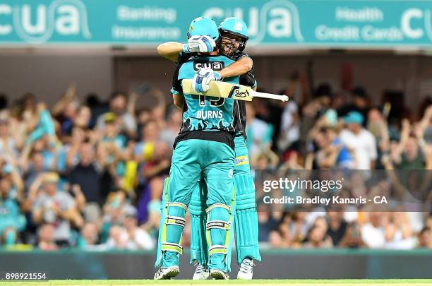 Joe Burns and Alex Ross of the Heat celebrate victory after the Big Bash League match between the Brisbane Heat and the Sydney Thunder at The Gabba...