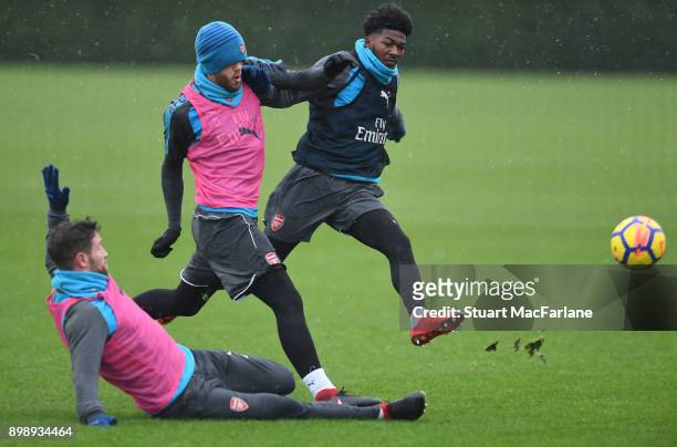 Shkodran Mustafi, Calum Chambers and Ainsley Maitland-Niles of Arsenal during a training session at London Colney on December 27, 2017 in St Albans,...