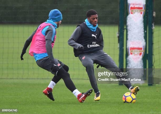 Chuba Akpom and Calum Chambers of Arsenal during a training session at London Colney on December 27, 2017 in St Albans, England.