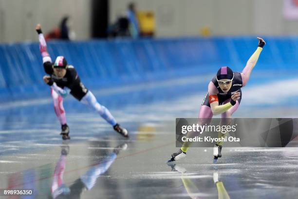 Arisa Go competes with Maki Tsuji in the Ladies' 500m during day one of the Speed Skating PyeongChang Winter Olympics qualifier at the M Wave on...