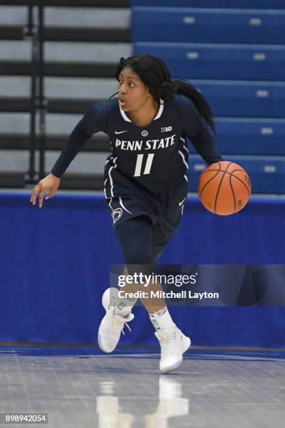 Teniya Page of the Penn State Lady Lions dribbles the ball up court during a women's college basketball game against the American University Eagles...