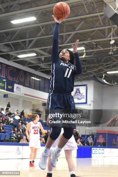 Teniya Page of the Penn State Lady Lions drives to the basket during a women's college basketball game against the American University Eagles at...