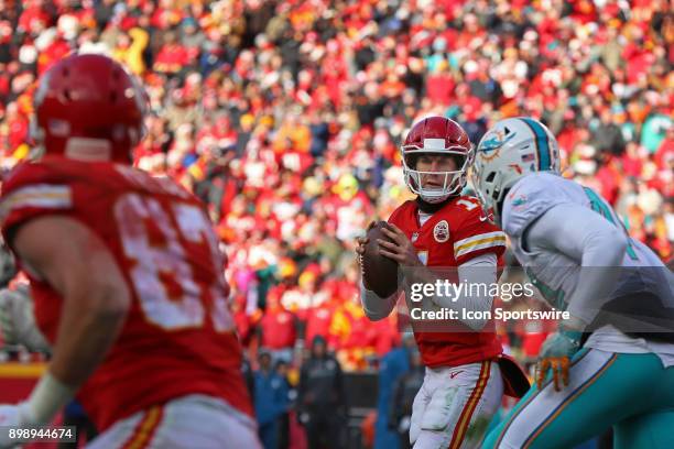 Kansas City Chiefs quarterback Alex Smith rolls out in the third quarter of a week 16 NFL game between the Miami Dolphins and Kansas City Chiefs on...