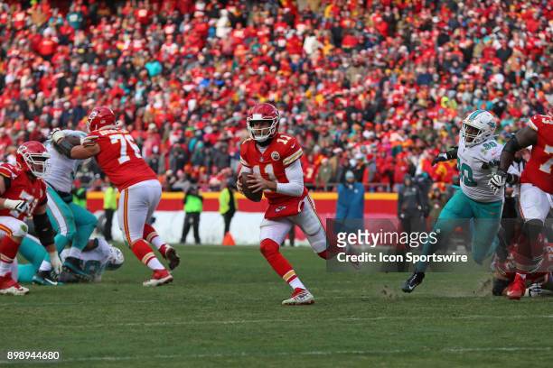 Kansas City Chiefs quarterback Alex Smith rolls out to avoid pressure in the fourth quarter of a week 16 NFL game between the Miami Dolphins and...