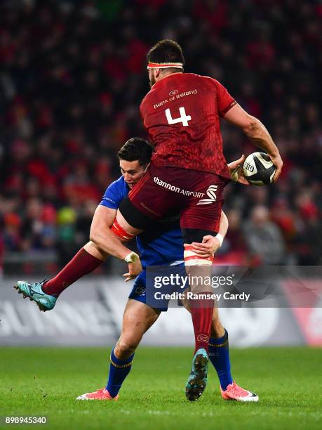 Limerick , Ireland - 26 December 2017; Jean Kleyn of Munster is tackled by Noel Reid of Leinster during the Guinness PRO14 Round 11 match between...