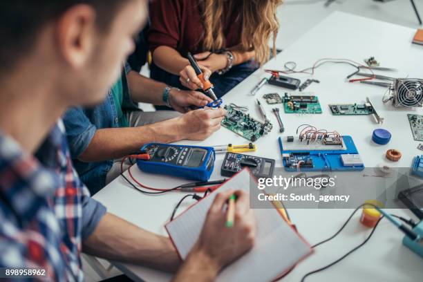 determined students engineers - students robotics stock pictures, royalty-free photos & images