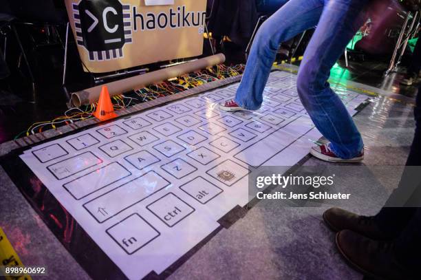 Participant attends the 34C3 Chaos Communication Congress of the Chaos Computer Club on December 27, 2017 in Leipzig, Germany. The annual congress...