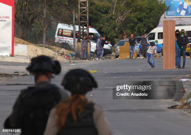 Israeli security forces intervene in Palestinians near Hawara checkpoint, south of the West Bank city of Nablus, during clashes following a...