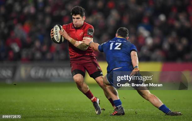 Limerick , Ireland - 26 December 2017; Alex Wootton of Munster is tackled by Robbie Henshaw of Leinster during the Guinness PRO14 Round 11 match...