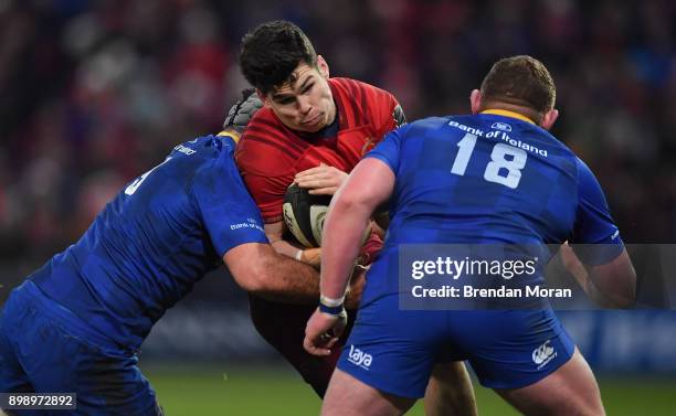 Limerick , Ireland - 26 December 2017; Alex Wootton of Munster is tackled by Mick Kearney, left, and Tadhg Furlong of Leinster during the Guinness...