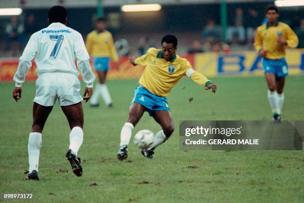 Former Brazilian soccer star, Edson Arantes do Nascimento, known as Pelé , plays the ball during a friendly soccer match opposing Brazil to world...