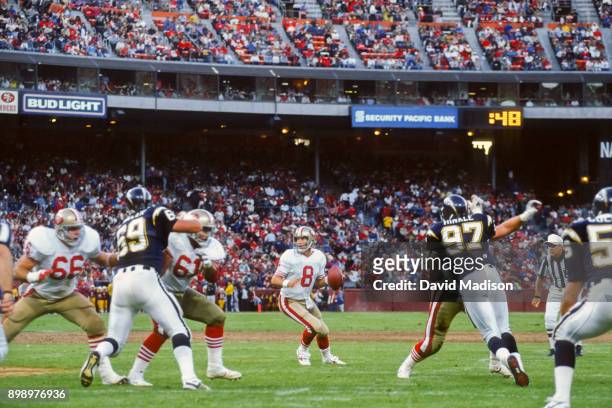 Steve Young of the San Francisco 49ers looks to pass during a pre-season National Football League game against the San Diego Chargers played on...