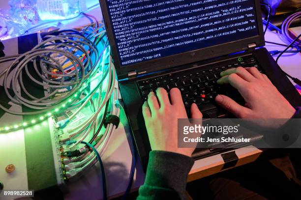 Participant attends the 34C3 Chaos Communication Congress of the Chaos Computer Club on December 27, 2017 in Leipzig, Germany. The annual congress...