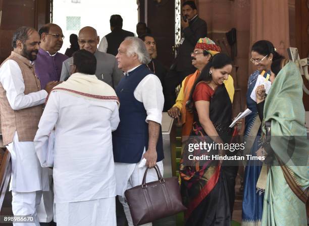 Union Minister of state home affairs Hansraj Gangaram Ahir talking with Congress MP Jairam Ramesh and other party MP's after attending Parliament...