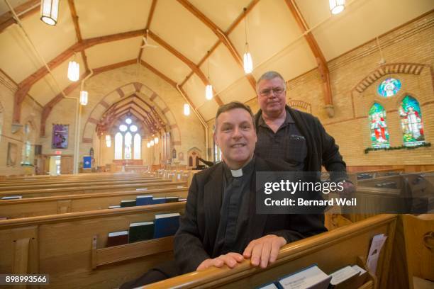 All Saints Anglican Church Archdeacon Stephen Vail and parishioner Roy Allam pose inside the rebuilt church. In 2009 a fire destroyed much of the...