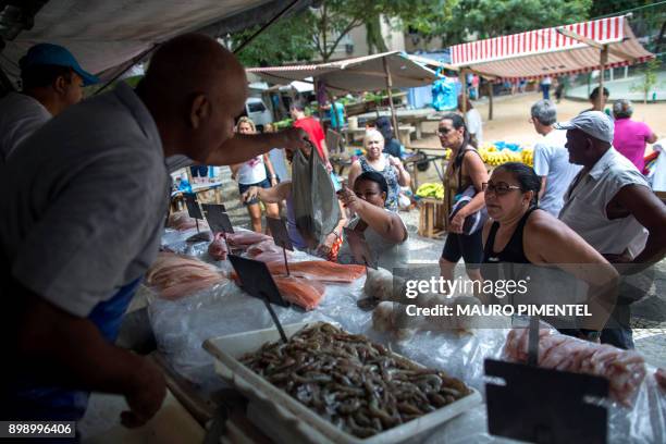 Fish is being sold at a street market in Rio de Janeiro, on December 27, 2017 a day after Brazil said it was suspending fish exports to the European...