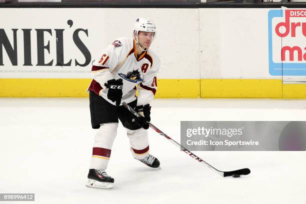 Cleveland Monsters defenceman Andre Benoit looks to pass during the third period of the American Hockey League game between the Milwaukee Admirals...