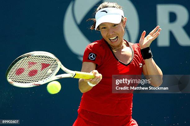 Jie Zheng of China returns a shot against Caroline Wozniack of Denmark during the Rogers Cup at the Rexall Center on August 19, in Toronto, Ontario,...