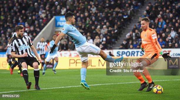 Sergio Aguero of Manchester City fails to control the ball from a cross watched by Rob Elliot of Newcastle United during the Premier League match...