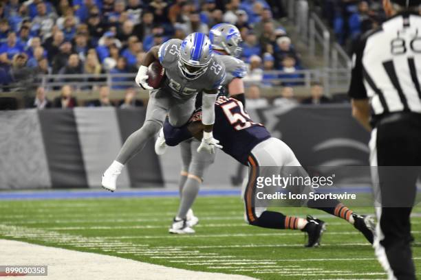 Detroit Lions RB Theo Riddick gets tackled near the sideline by Chicago Bears ILB Danny Trevathan in the NFL game between Chicago Bears and Detroit...