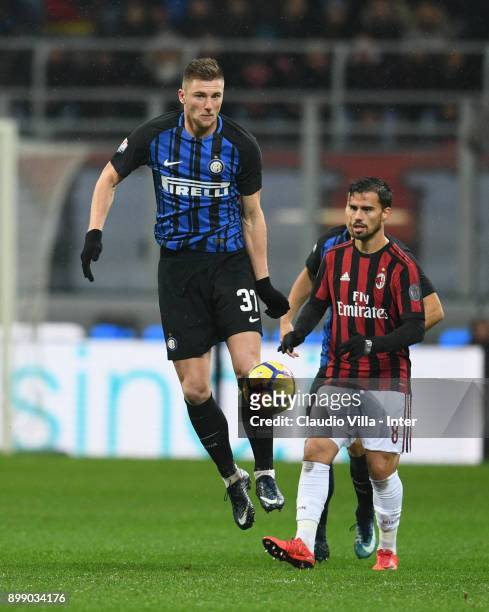 Milan Skriniar of FC Internazionale competes for the ball with Fernandez Suso of AC Milan during the TIM Cup match between AC Milan and FC...