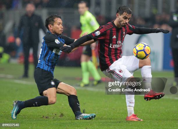 Fernandez Suso of AC Milan competes for the ball with Yuto Nagatomo of FC Internazionale Milano during the TIM Cup match between AC Milan and FC...