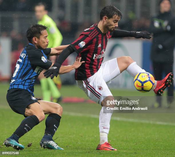 Fernandez Suso of AC Milan competes for the ball with Yuto Nagatomo of FC Internazionale Milano during the TIM Cup match between AC Milan and FC...