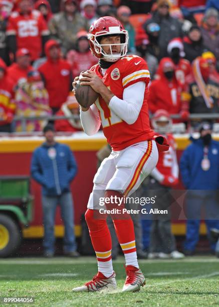 Quarterback Alex Smith of the Kansas City Chiefs drops back to pass against the Miami Dolphins during the first half of the game at Arrowhead Stadium...