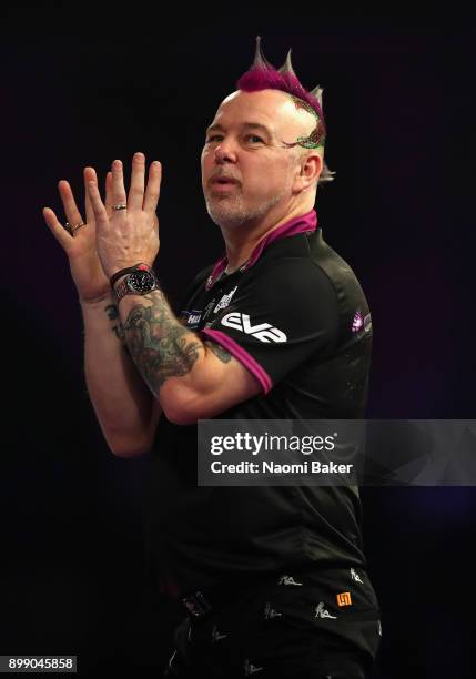 Peter Wright of England shows frustration during his second round match against Jamie Lewis of Wales on day eleven of the 2018 William Hill PDC World...