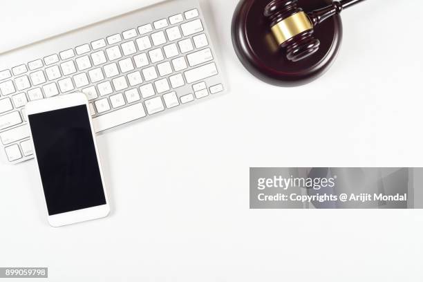 modern white legal office desk table with smartphone, judges gravel and computer keyboard top view, flat lay - office work flat lay stock pictures, royalty-free photos & images