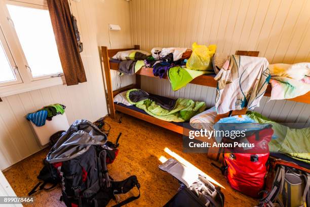 mess in the hostel. scattered things and backpacks - pousada de juventude imagens e fotografias de stock